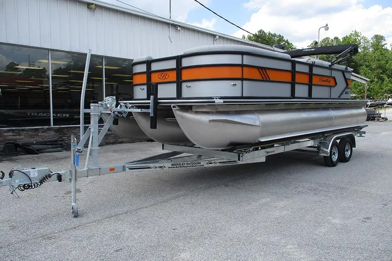 Slide: The Image of 2026 Bentley Pontoons 223 Bolt on trailer, parked outside dealership. - 3