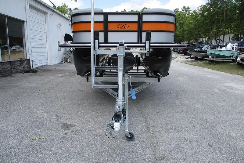 Slide: The Image of 2026 Bentley Pontoons 223 Bolt on trailer, parked outdoors near a building. - 4
