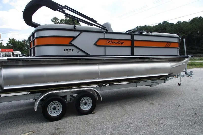Slide: The Image of 2026 Bentley Pontoons 223 Bolt on trailer, featuring sleek design and vibrant orange accents. - 6