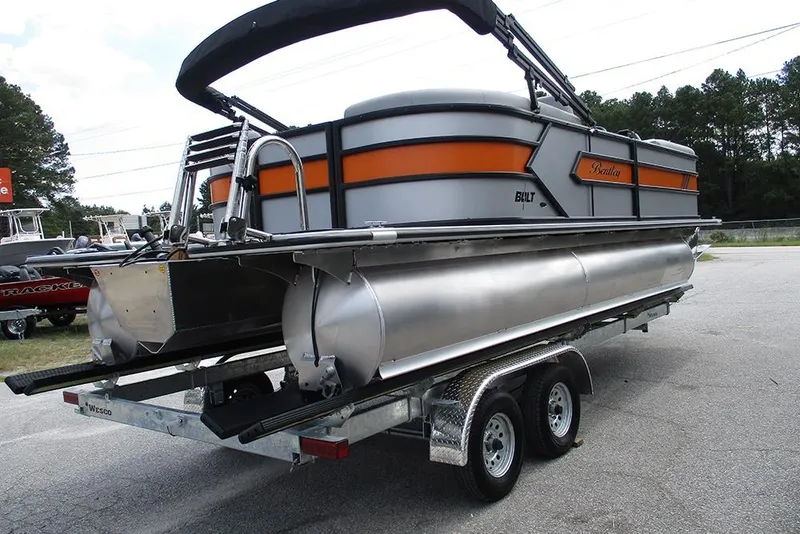Slide: The Image of 2026 Bentley Pontoons 223 Bolt on trailer, featuring sleek design and vibrant orange accents. - 7
