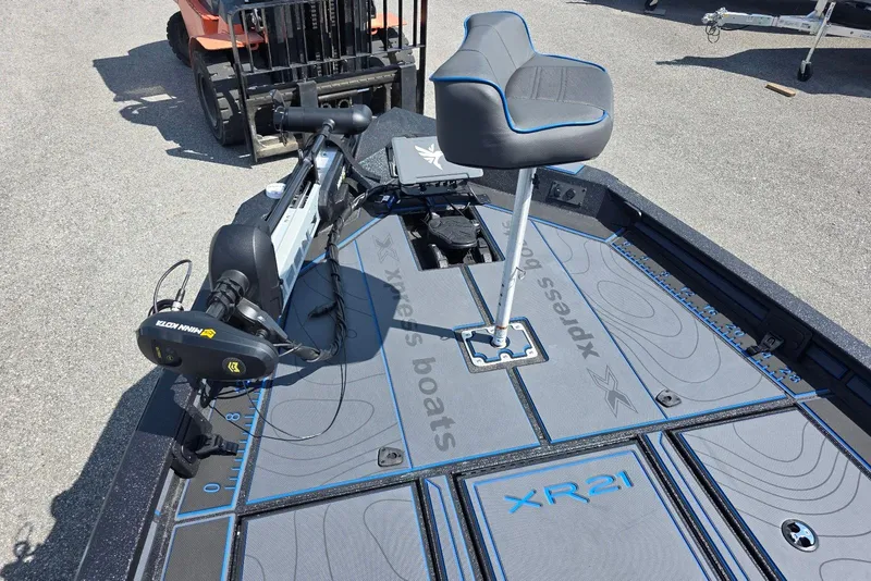 Slide: The Image of 2026 Xpress X21 Pro boat deck with seat and Minn Kota trolling motor. - 12