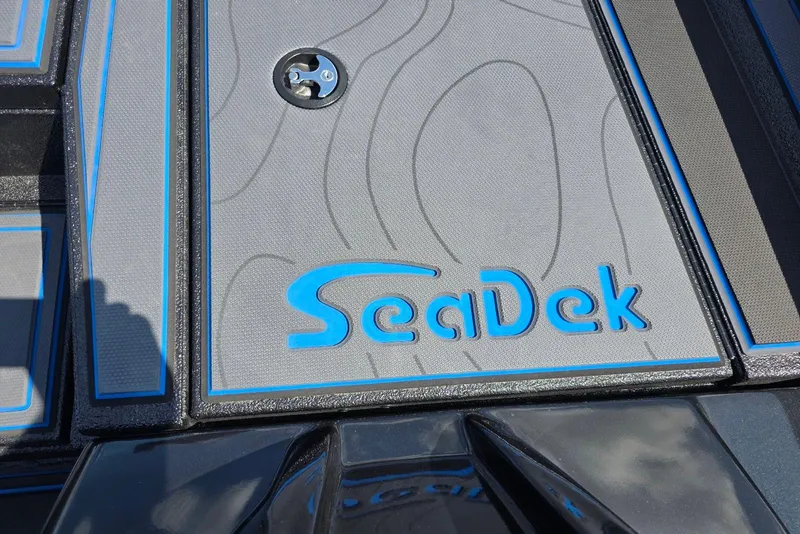 Slide: The Image of SeaDek logo on Xpress X21 Pro 2026 boat deck, featuring blue accents and textured surface. - 14