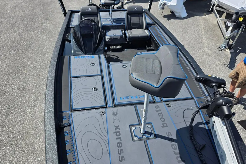 Slide: The Image of 2026 Xpress X21 Pro boat interior with seating and deck details. - 15