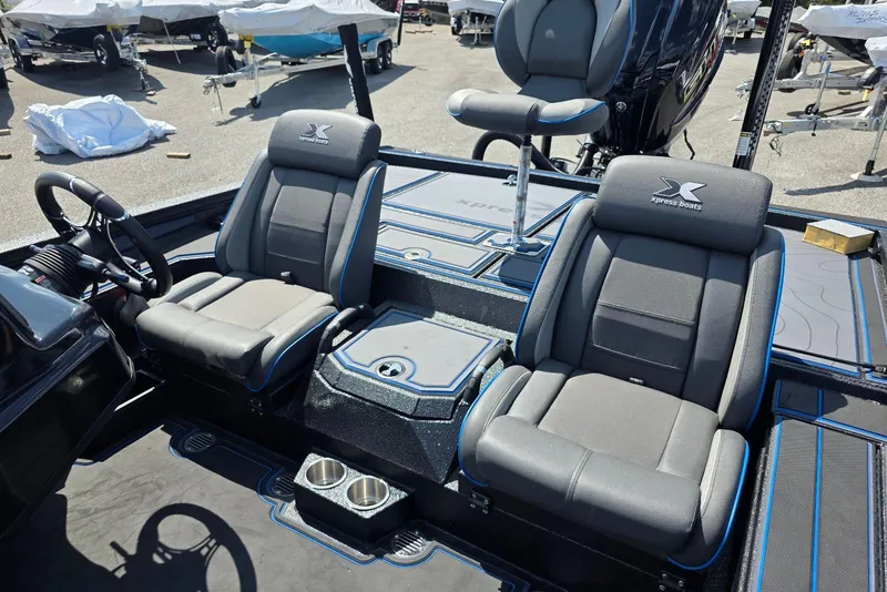 Slide: The Image of 2026 Xpress X21 Pro boat interior with dual seats and steering wheel, showcasing modern design. - 16