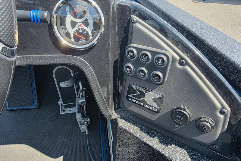 Slide: The Image of Dashboard of 2026 Xpress X21 Pro boat with gauges and control panel. - 18