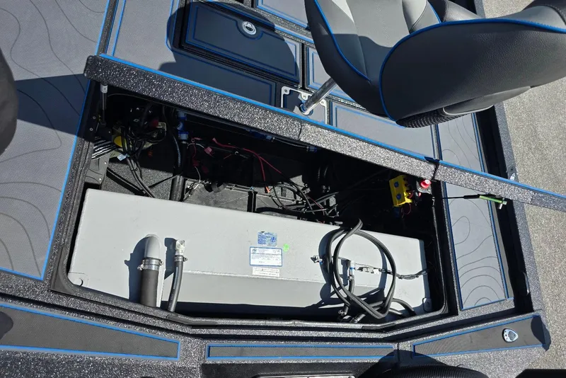 Slide: The Image of Open storage compartment in 2026 Xpress X21 Pro boat, showing internal components and wiring. - 20