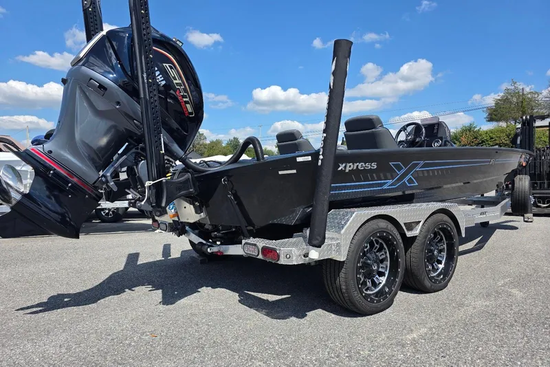 Slide: The Image of 2026 Xpress X21 Pro boat on trailer, featuring sleek design and powerful engine. - 5