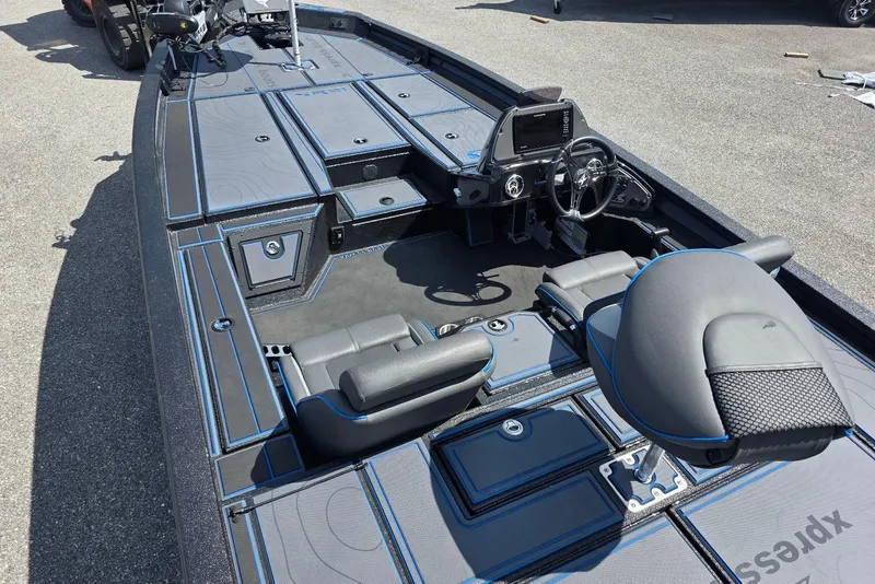 Slide: The Image of 2026 Xpress X21 Pro boat interior with modern seating and control console. - 8