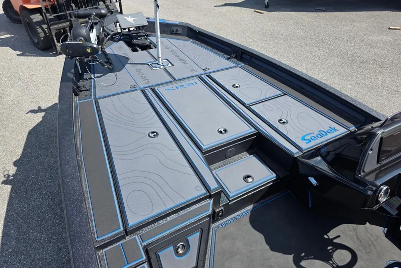 Slide: The Image of 2026 Xpress X21 Pro boat deck with SeaDek flooring and advanced fishing equipment. - 9