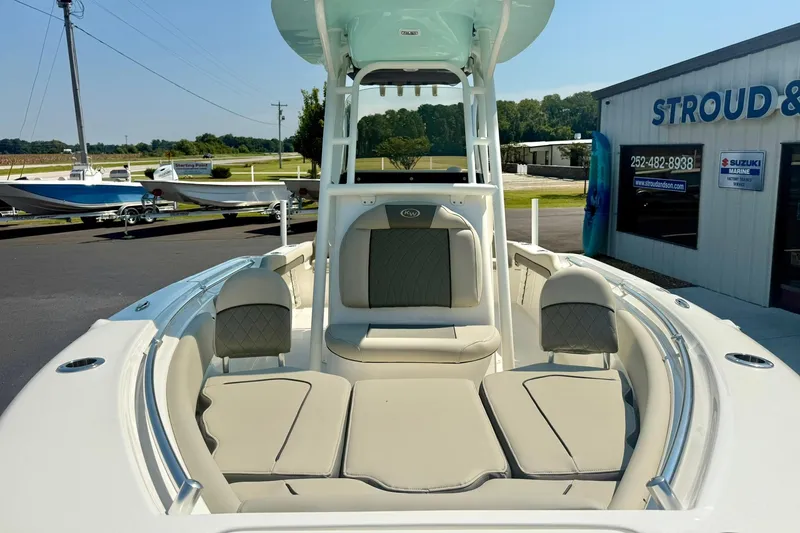 Slide: The Image of 2026 Key West 219 FS boat with beige seating, displayed at Stroud & Son dealership. - 15
