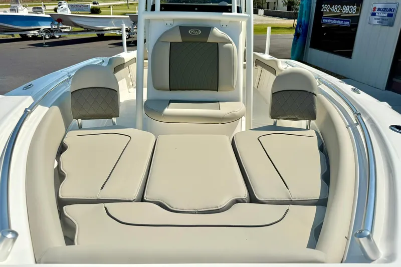 Slide: The Image of 2026 Key West 219 FS boat interior with cushioned seating and sleek design. - 16