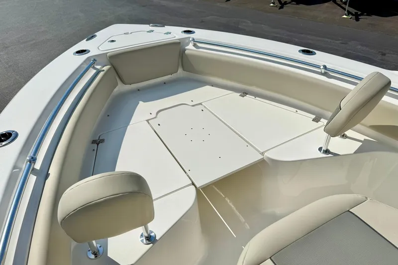 Slide: The Image of 2026 Key West 219 FS boat interior with cushioned seating and sleek design. - 20