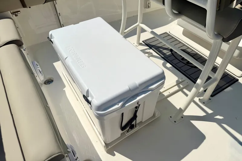 Slide: The Image of 2026 Key West 219 FS boat interior with cooler and seating area. - 34