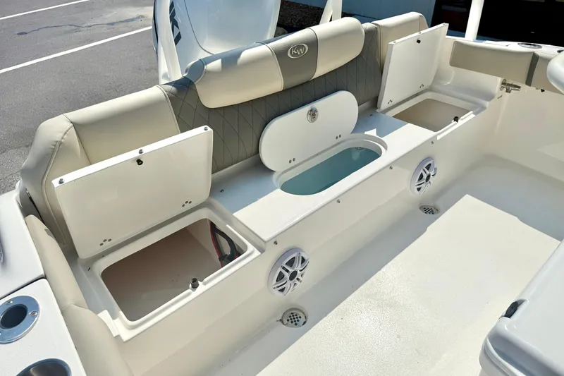 Slide: The Image of 2026 Key West 219 FS boat interior with storage compartments and seating. - 38