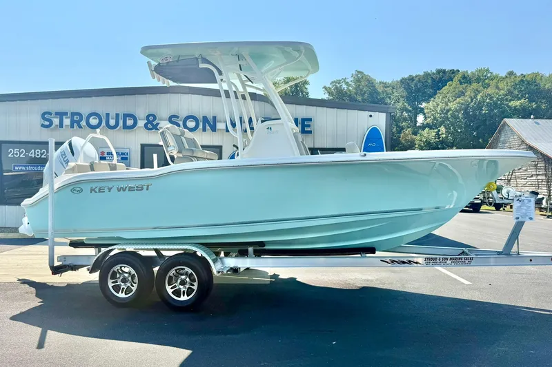 Slide: The Image of 2026 Key West 219 FS boat on trailer at Stroud & Son Marine dealership. - 7