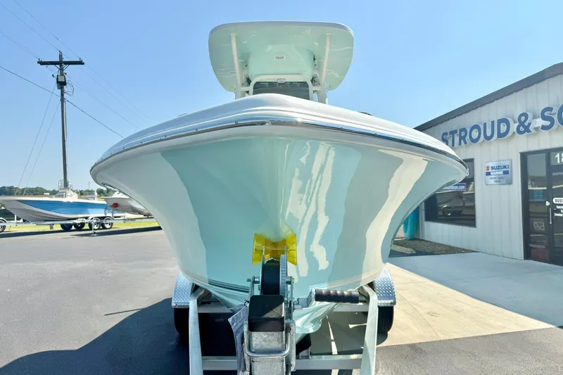 Slide: The Image of 2026 Key West 219 FS boat on trailer outside dealership, sunny day. - 8