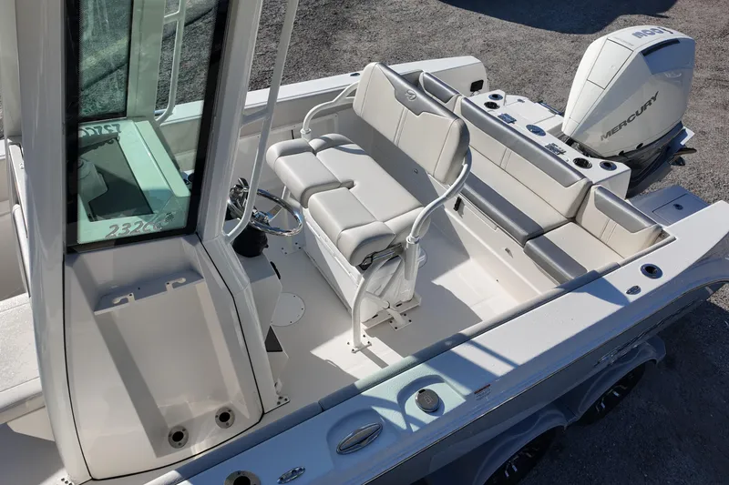Slide: The Image of 2026 Sailfish 232 CC boat interior with seating and Mercury engine. - 16