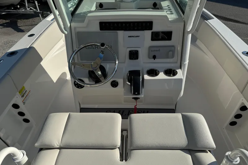 Slide: The Image of 2026 Sailfish 232 CC boat cockpit with steering wheel and control panel. - 18