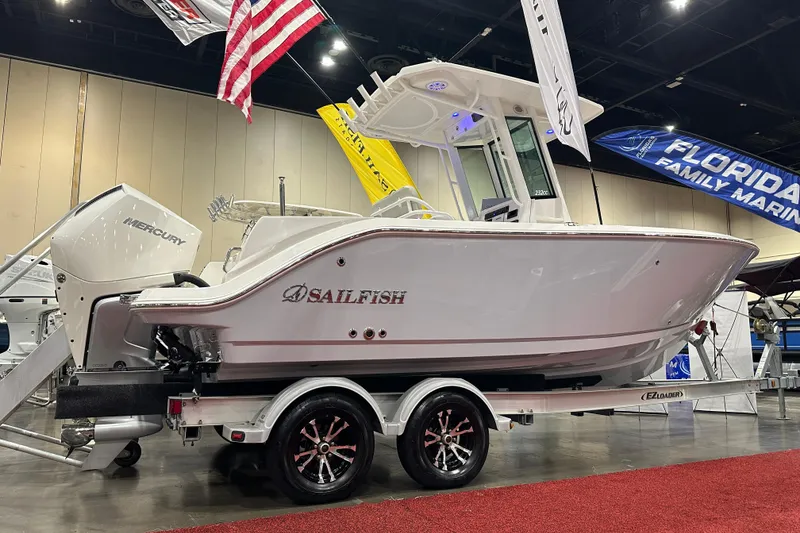 Slide: The Image of 2026 Sailfish 232 CC boat on display at a marine exhibition. - 2