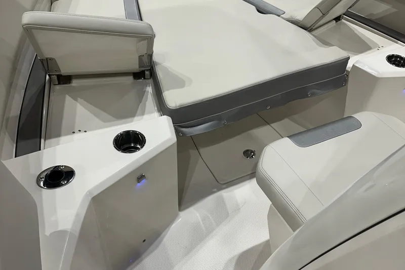 Slide: The Image of Interior of 2026 Sailfish 232 CC boat with cushioned seating and cup holders. - 9