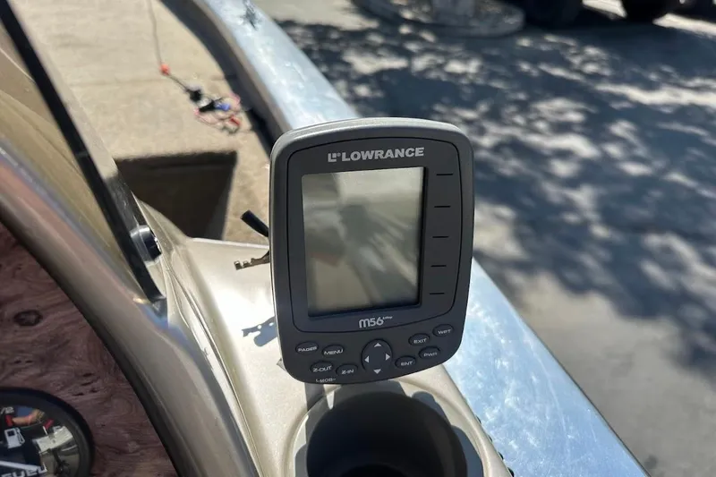 Slide: The Image of Lowrance fish finder on 2001 Bass Tracker Pro Team 175 boat dashboard. - 18