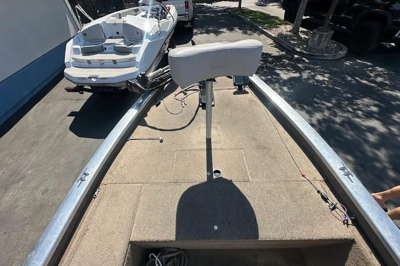 Slide: The Image of 2001 Bass Tracker Pro Team 175 boat interior with seating and fishing setup. - 21