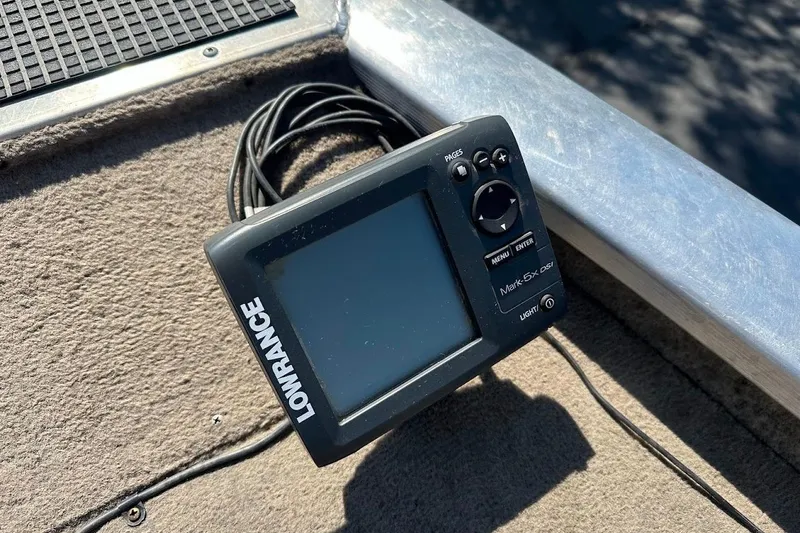 Slide: The Image of Lowrance fish finder on 2001 Bass Tracker Pro Team 175 boat deck. - 23