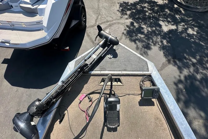 Slide: The Image of 2001 Bass Tracker Pro Team 175 boat deck with trolling motor and fish finder. - 24