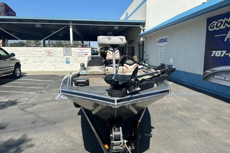 Slide: The Image of 2001 Bass Tracker Pro Team 175 boat parked outside a dealership. - 5