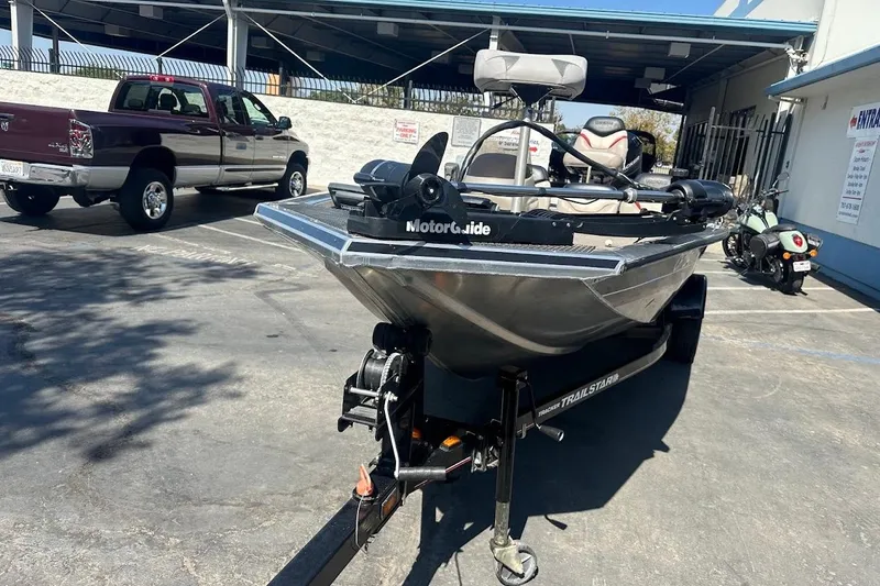 Slide: The Image of 2001 Bass Tracker Pro Team 175 boat on trailer in parking lot. - 6