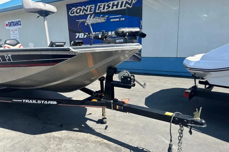 Slide: The Image of 2001 Bass Tracker Pro Team 175 boat on trailer at dealership. - 7