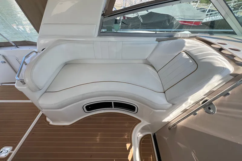 Slide: The Image of Luxurious seating on 2001 Sea Ray 290 Sundancer boat with elegant white upholstery. - 10