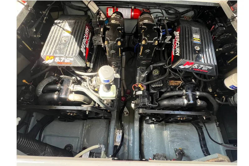 Slide: The Image of Engine compartment of a 2001 Sea Ray 290 Sundancer with twin Mercury 5.7L engines. - 24