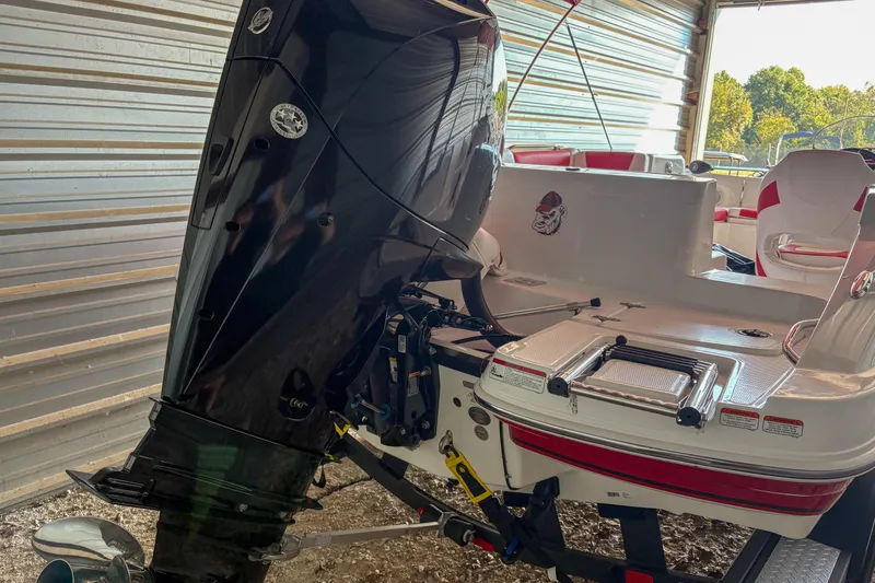 Slide: The Image of 2019 Tahoe 2150 boat with outboard motor in a storage facility. - 19