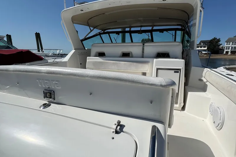 Slide: The Image of 2000 Tiara Yachts 3500 Express boat interior with seating and storage compartments. - 10