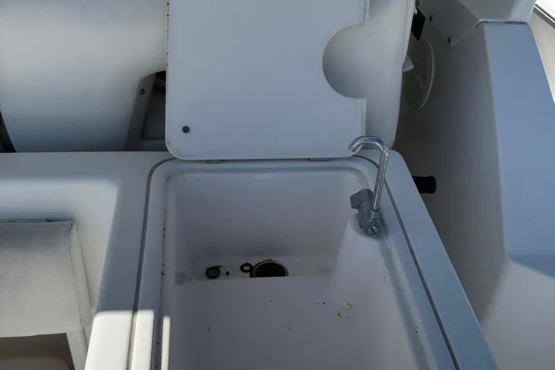 Slide: The Image of Tiara Yachts 3500 Express 2000 model sink area with faucet and storage compartment. - 17