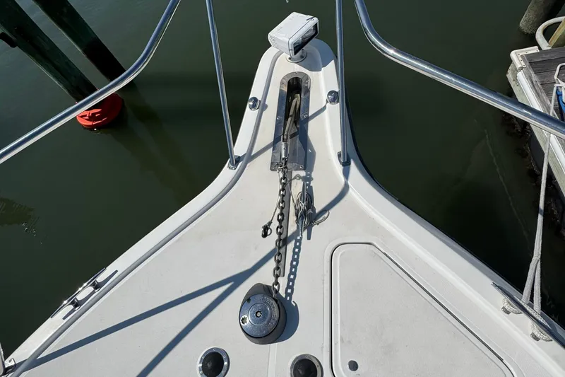 Slide: The Image of Bow of 2000 Tiara Yachts 3500 Express with anchor and chain visible. - 19