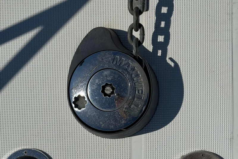 Slide: The Image of Anchor windlass on 2000 Tiara Yachts 3500 Express, featuring Maxwell branding. - 21