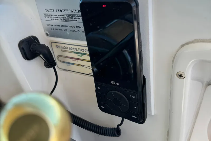 Slide: The Image of Vesper marine radio on 2000 Tiara Yachts 3500 Express, with yacht certification plaque. - 26