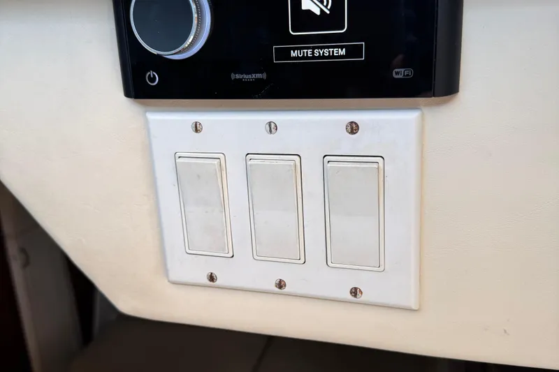 Slide: The Image of Control panel with three switches on a 2000 Tiara Yachts 3500 Express. - 29