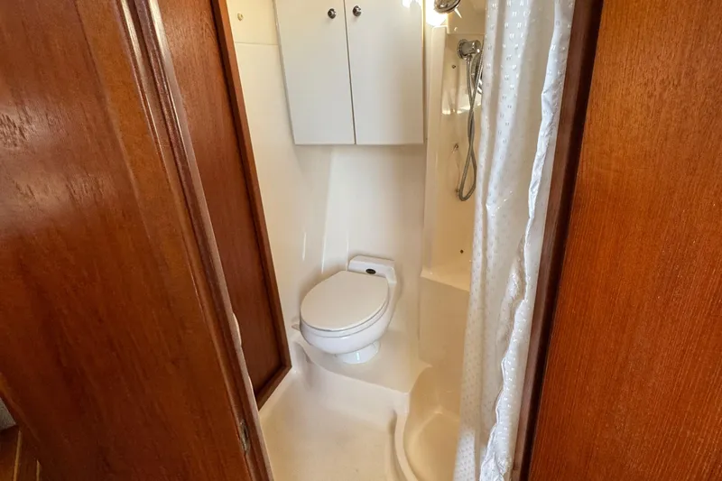 Slide: The Image of Bathroom interior of 2000 Tiara Yachts 3500 Express with shower and toilet. - 49