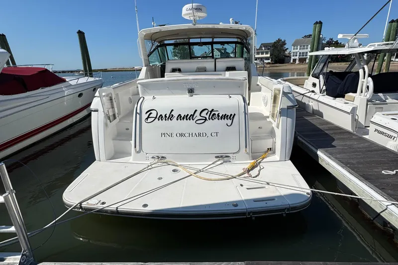 Slide: The Image of 2000 Tiara Yachts 3500 Express docked, named "Dark and Stormy," Pine Orchard, CT. - 5