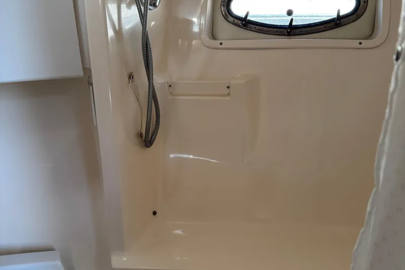 Slide: The Image of Interior shower area of a 2000 Tiara Yachts 3500 Express, featuring a sleek design. - 52