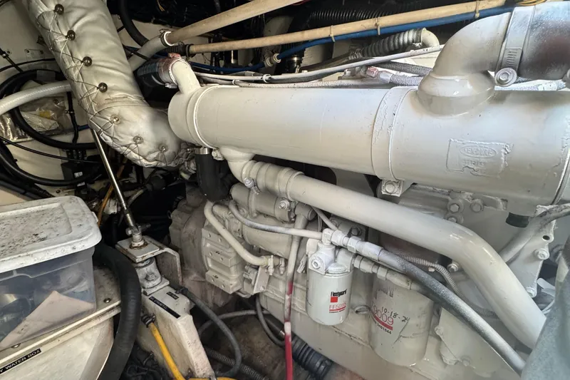 Slide: The Image of Engine room of a 2000 Tiara Yachts 3500 Express, showcasing detailed mechanical components. - 55
