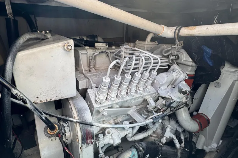 Slide: The Image of Engine compartment of a 2000 Tiara Yachts 3500 Express, showcasing mechanical components. - 59