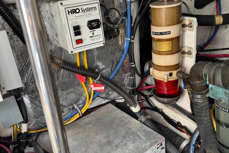 Slide: The Image of Engine room of 2000 Tiara Yachts 3500 Express with HRO Systems and fuel filter. - 60