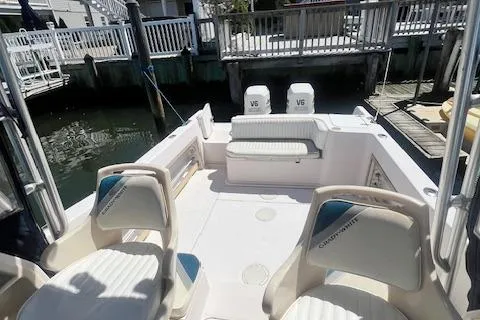 Slide: The Image of 1996 Grady-White Voyager 248 boat interior with seating and twin V6 engines. - 11