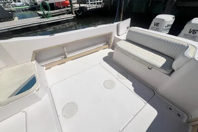 Slide: The Image of 1996 Grady-White Voyager 248 boat interior with seating and twin V6 engines. - 13