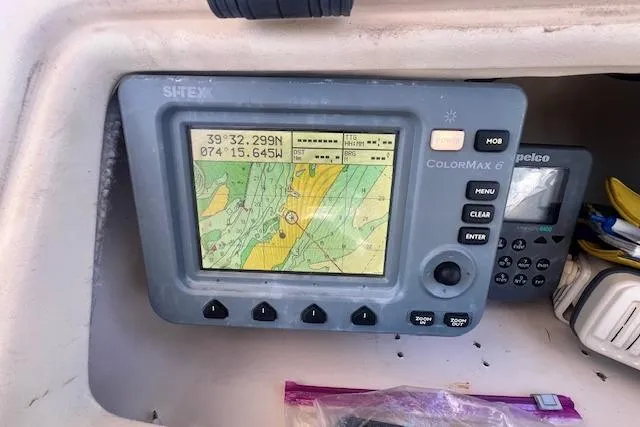 Slide: The Image of Navigation system on 1996 Grady-White Voyager 248 boat dashboard. - 4