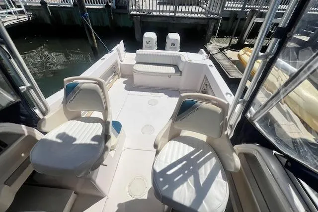 Slide: The Image of 1996 Grady-White Voyager 248 boat interior with seating and twin V6 engines. - 8